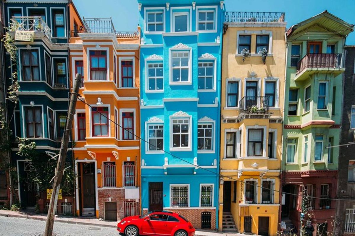 a red car parked in front of a building