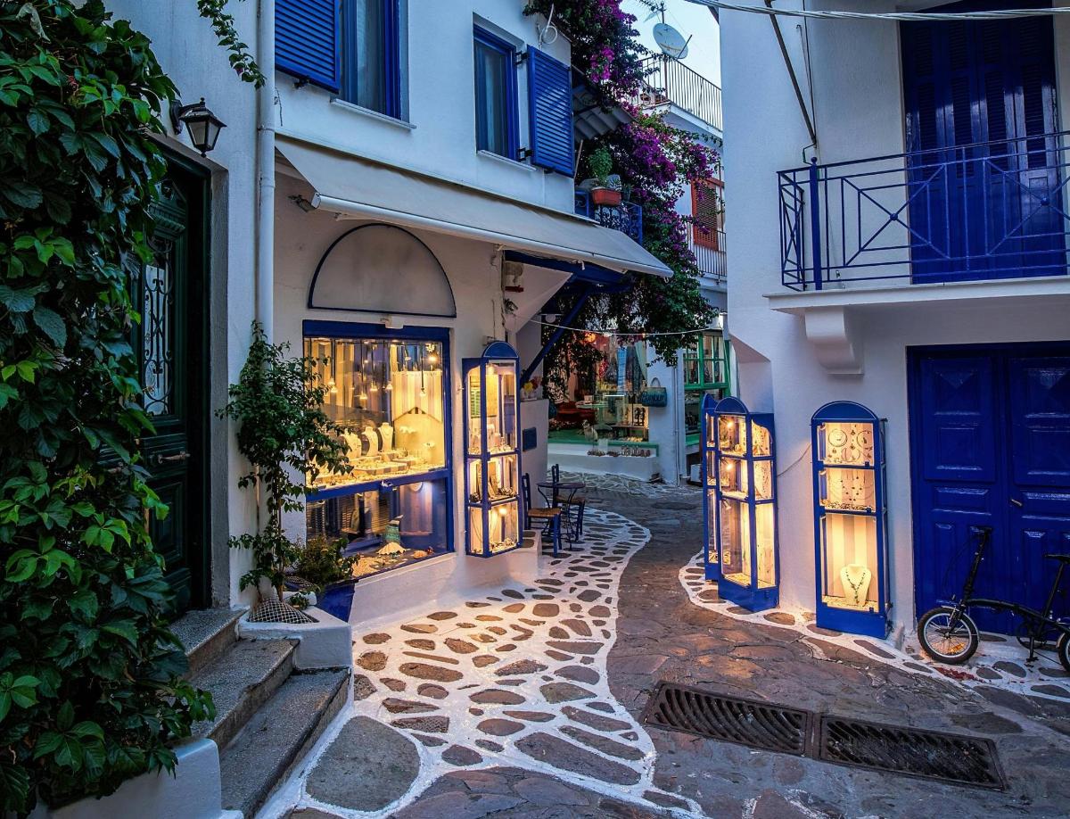 a street in a town with a building with windows