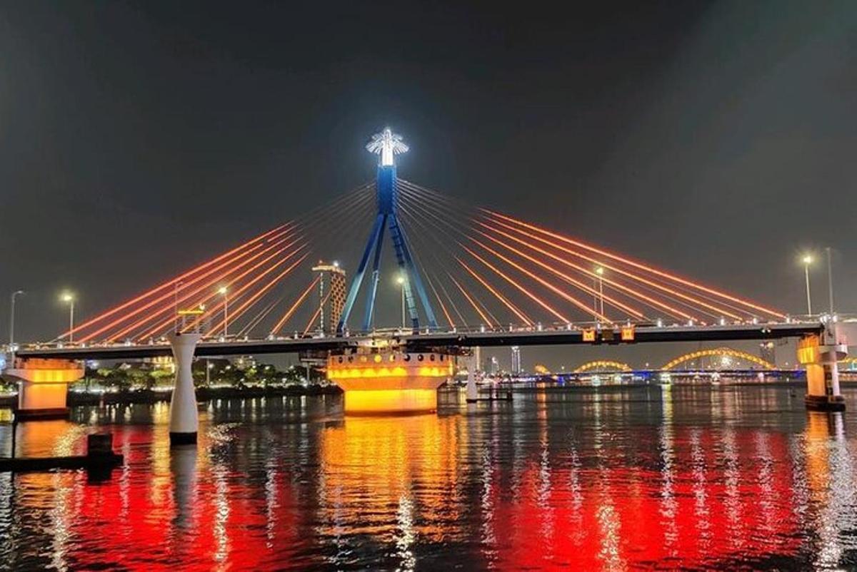a bridge over the water at night