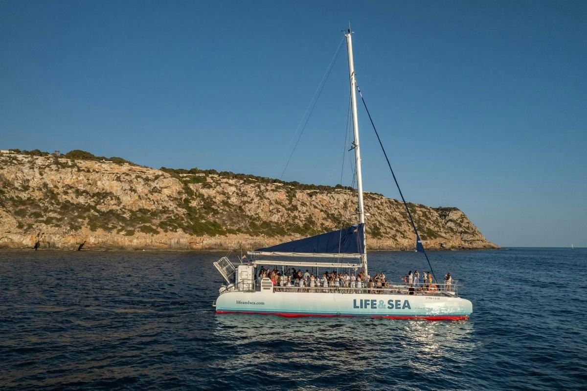 a boat with people on it in the water