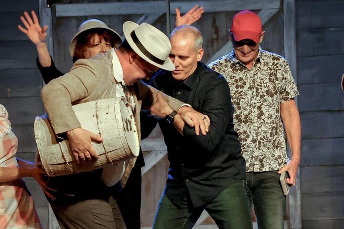 a group of men standing around a man in a hat