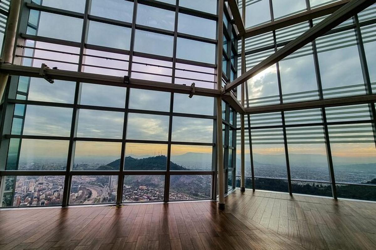 a room with large windows with a view of a city