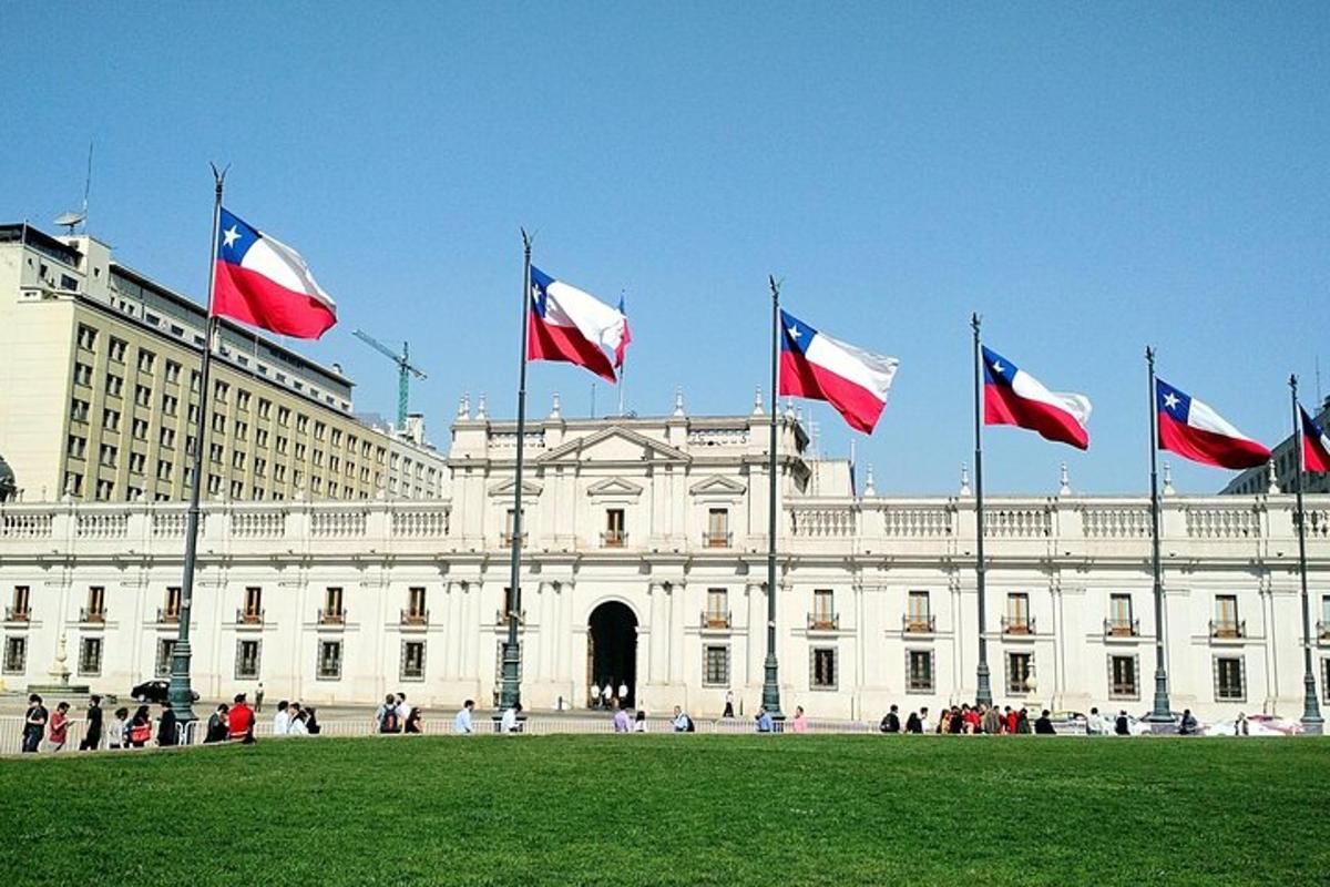 a group of flags in front of a building