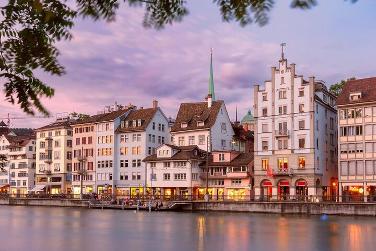 a group of buildings next to a river