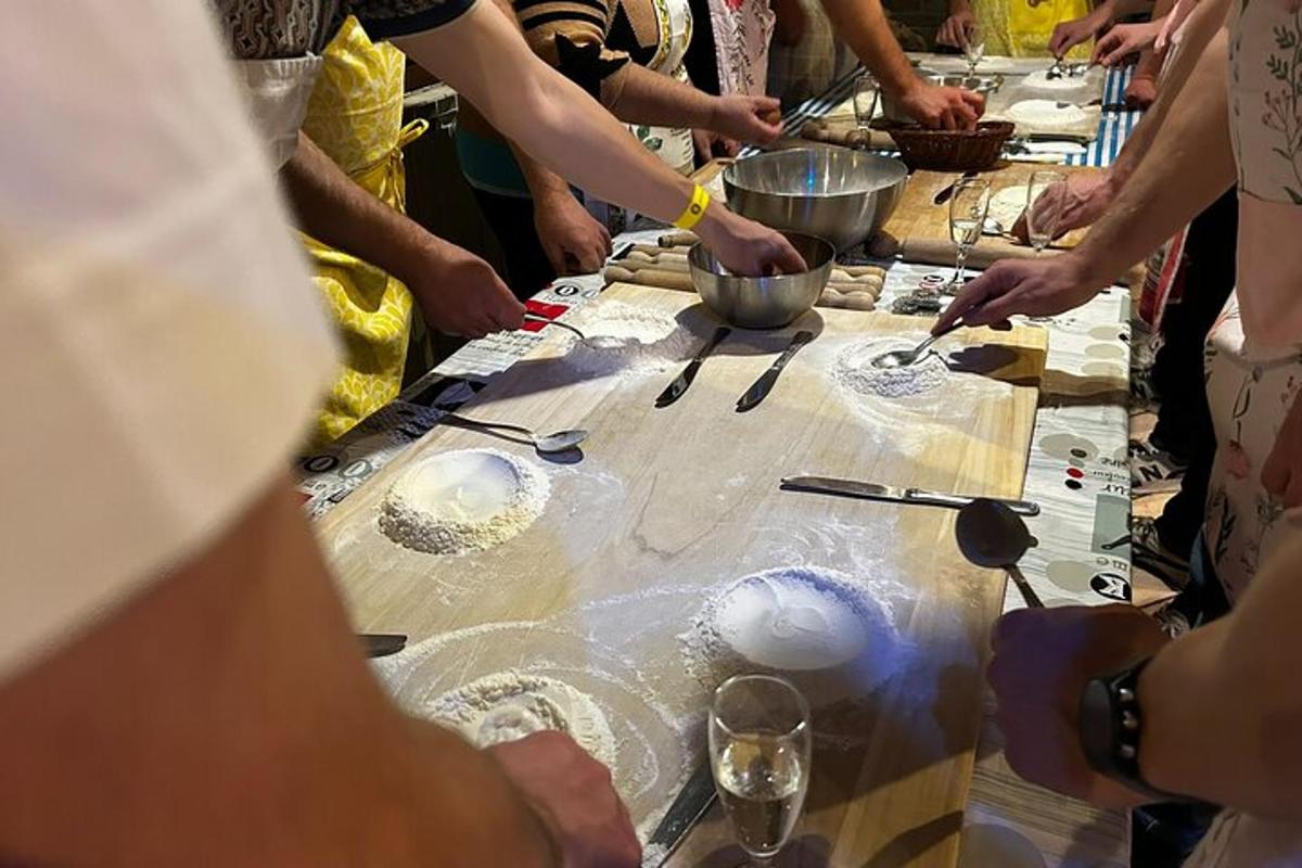 a group of people making food on a table