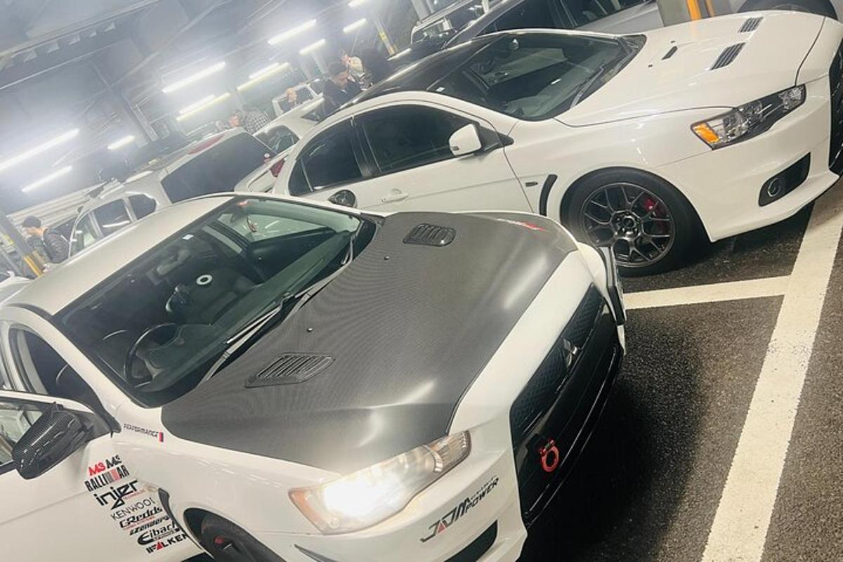 a group of cars parked in a parking lot