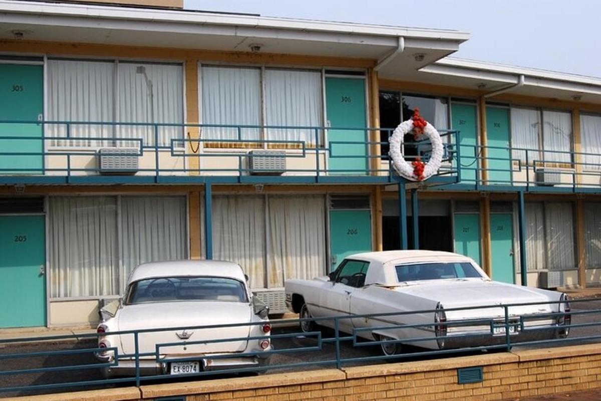 two old cars parked in front of a building