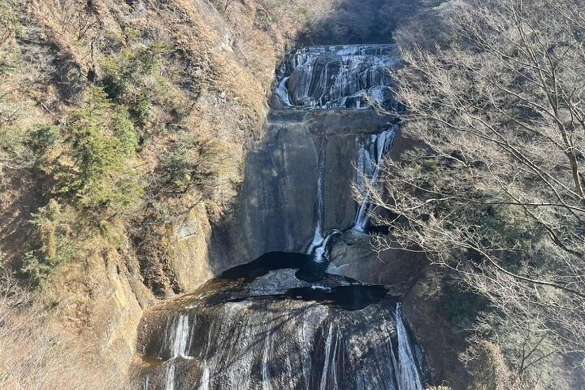 an aerial view of a waterfall on a mountain