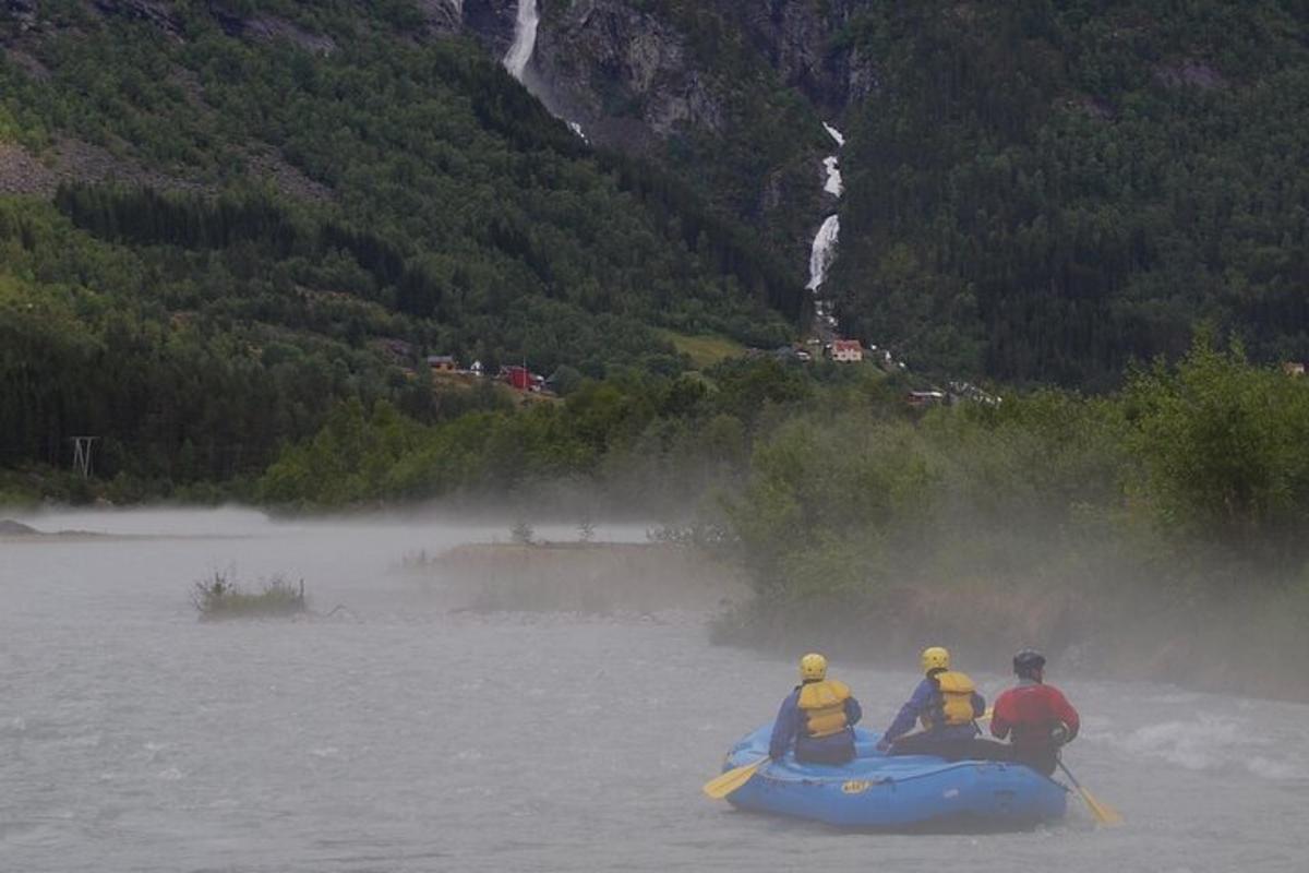 a group of people on a raft on a river