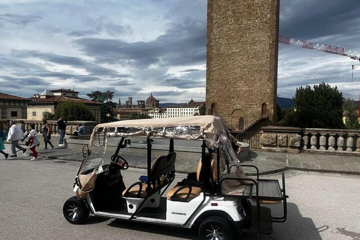 a golf cart parked in the street with people walking