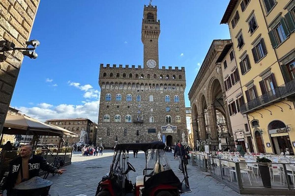 a large building with a clock tower in a city