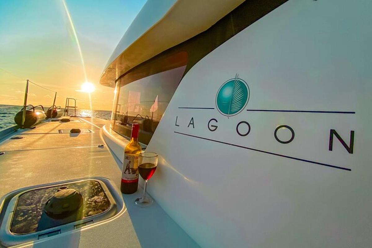 a boat with a bottle and a glass of wine