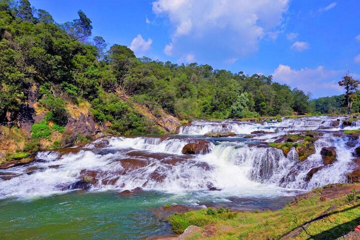 a waterfall in the middle of a river