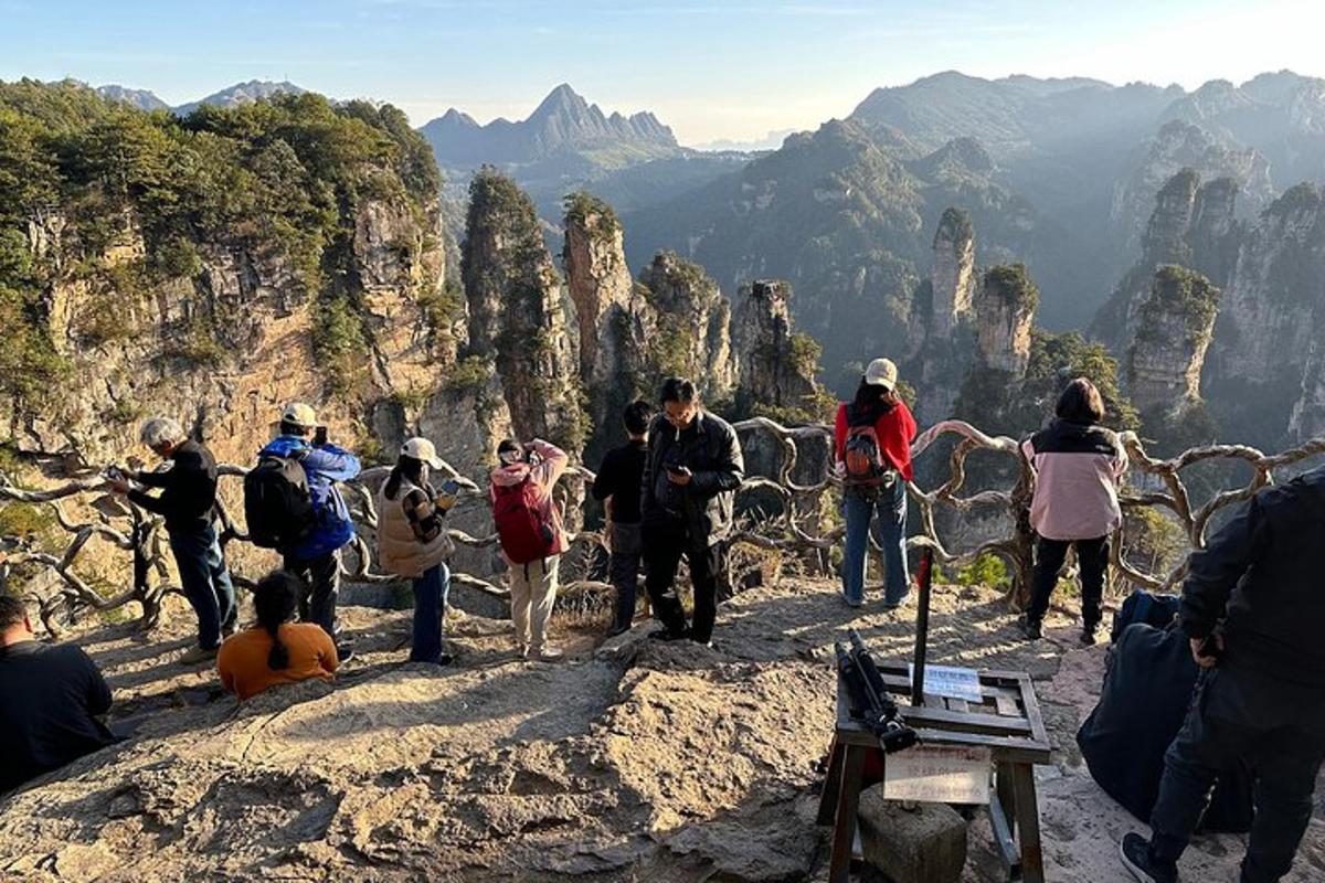 a group of people standing on top of a mountain