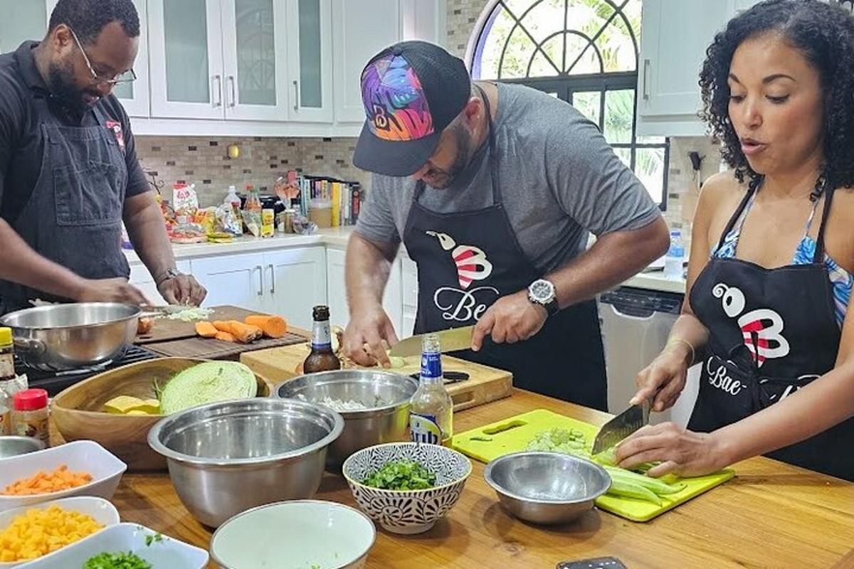 a group of people in a kitchen preparing food