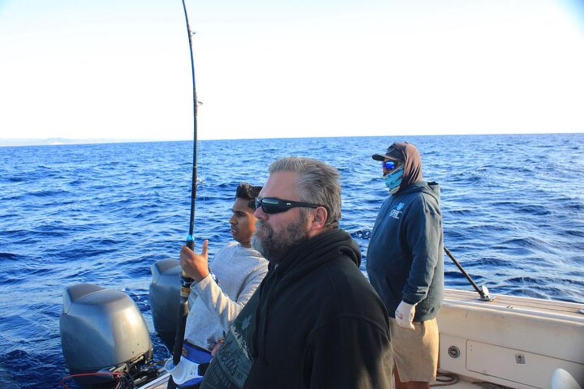 a group of people on a boat in the water