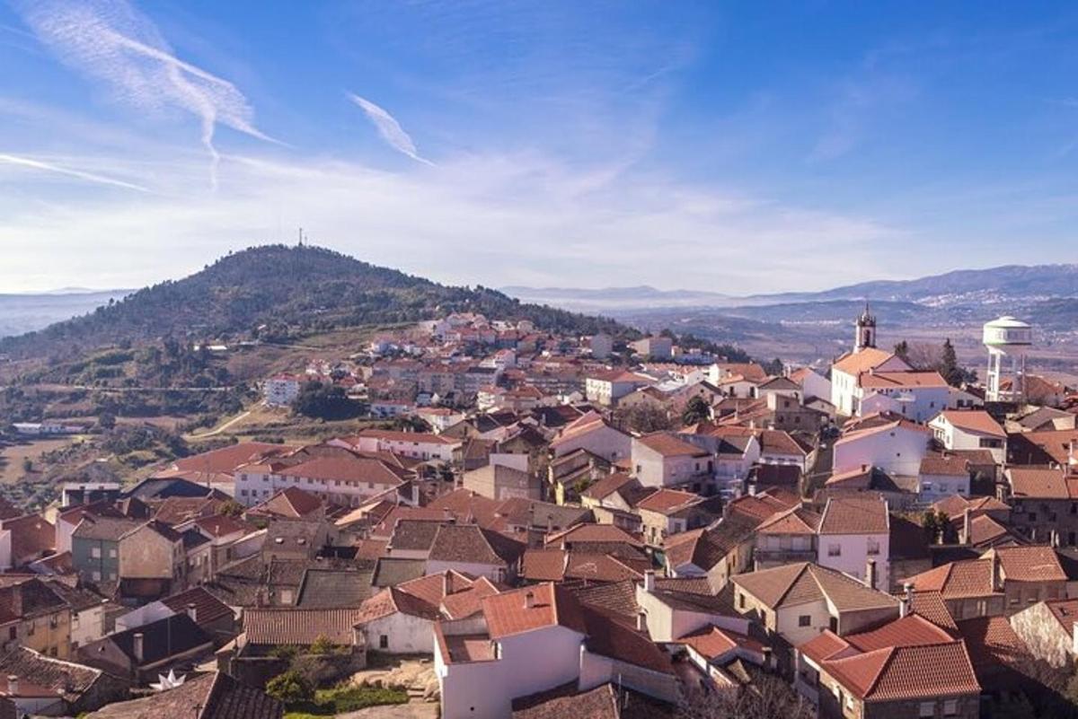 a view of a town with houses on a hill