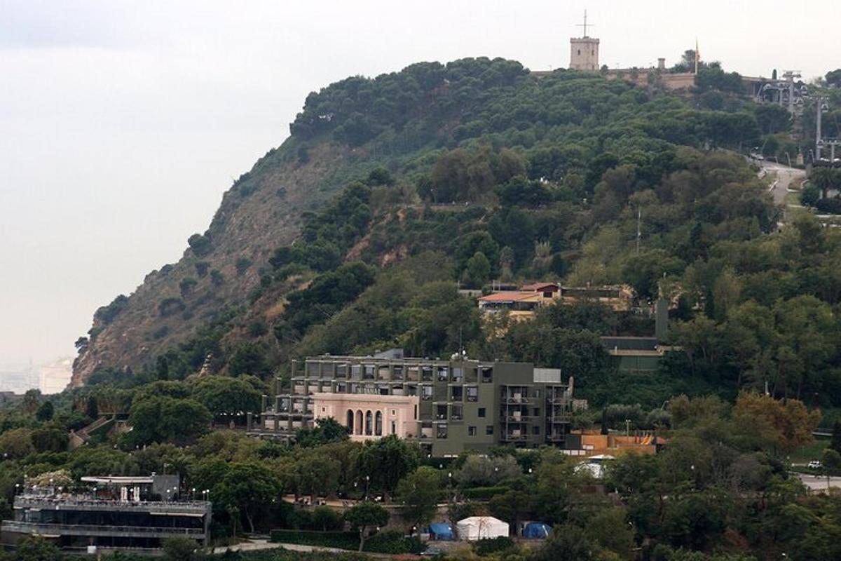a house on a hill with a building on it