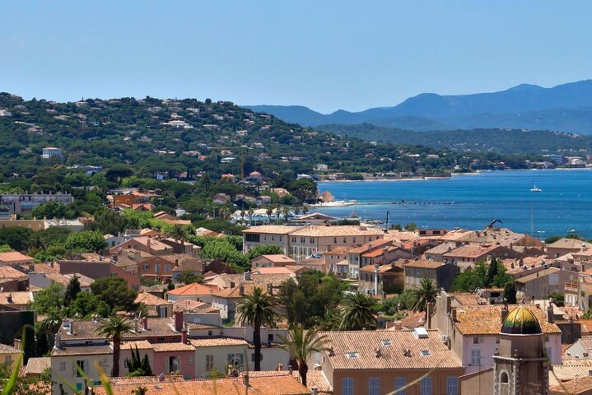a view of a town with houses and the water