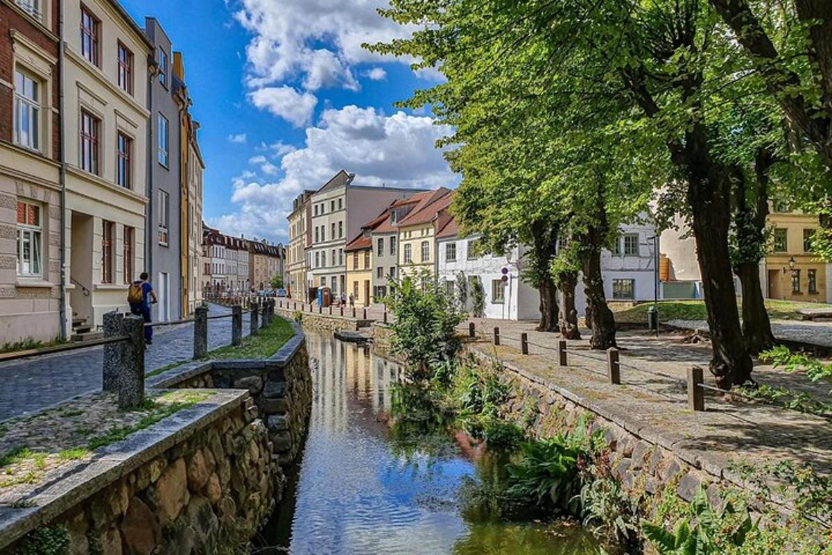 a canal in the middle of a city with buildings