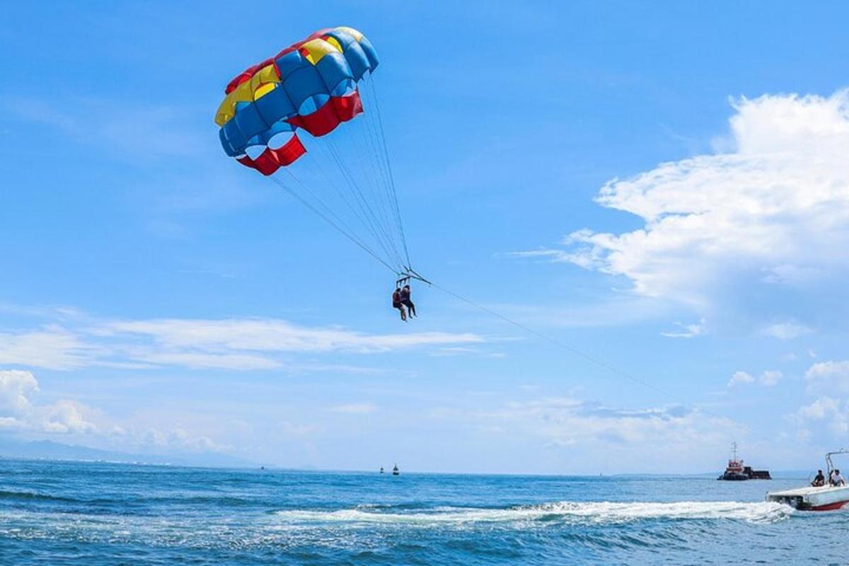 a person para sailing in the ocean with a parachute