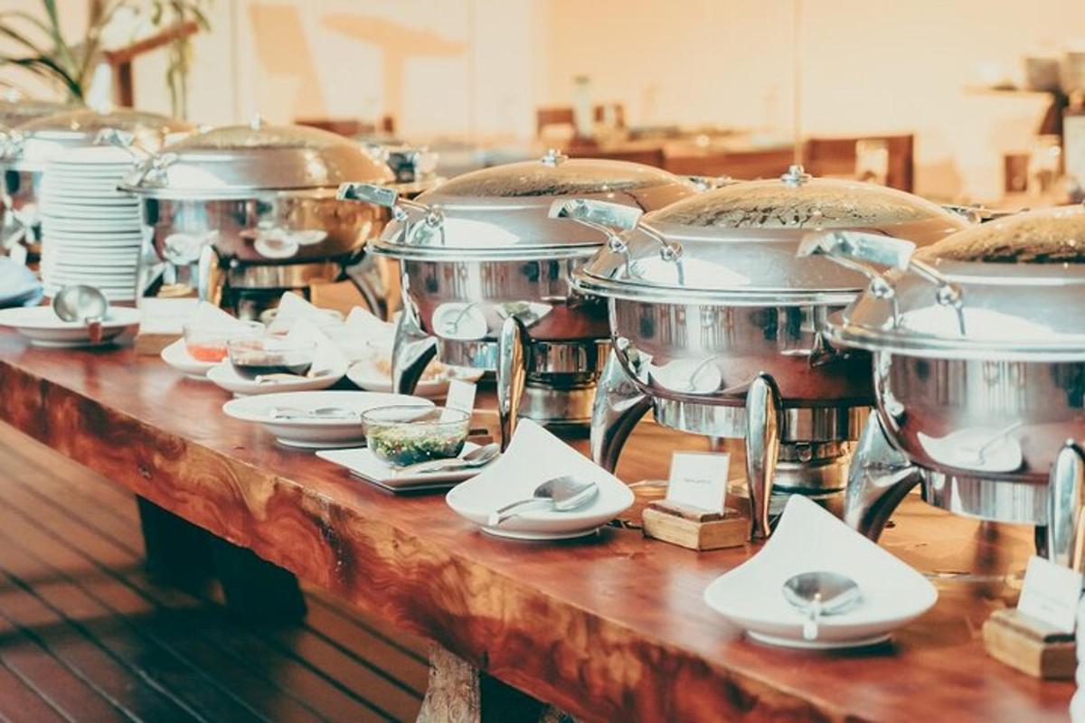 a table with several pots and plates of food