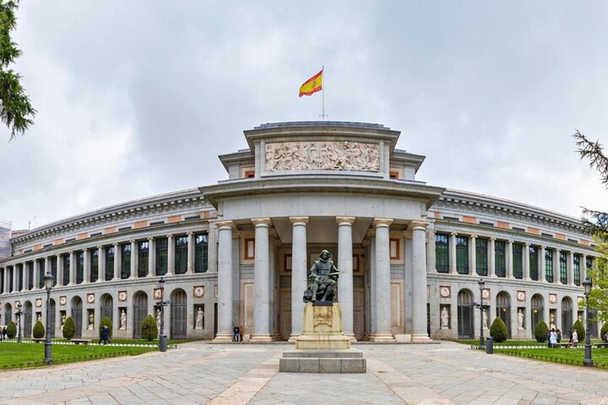 a large building with a statue in front of it