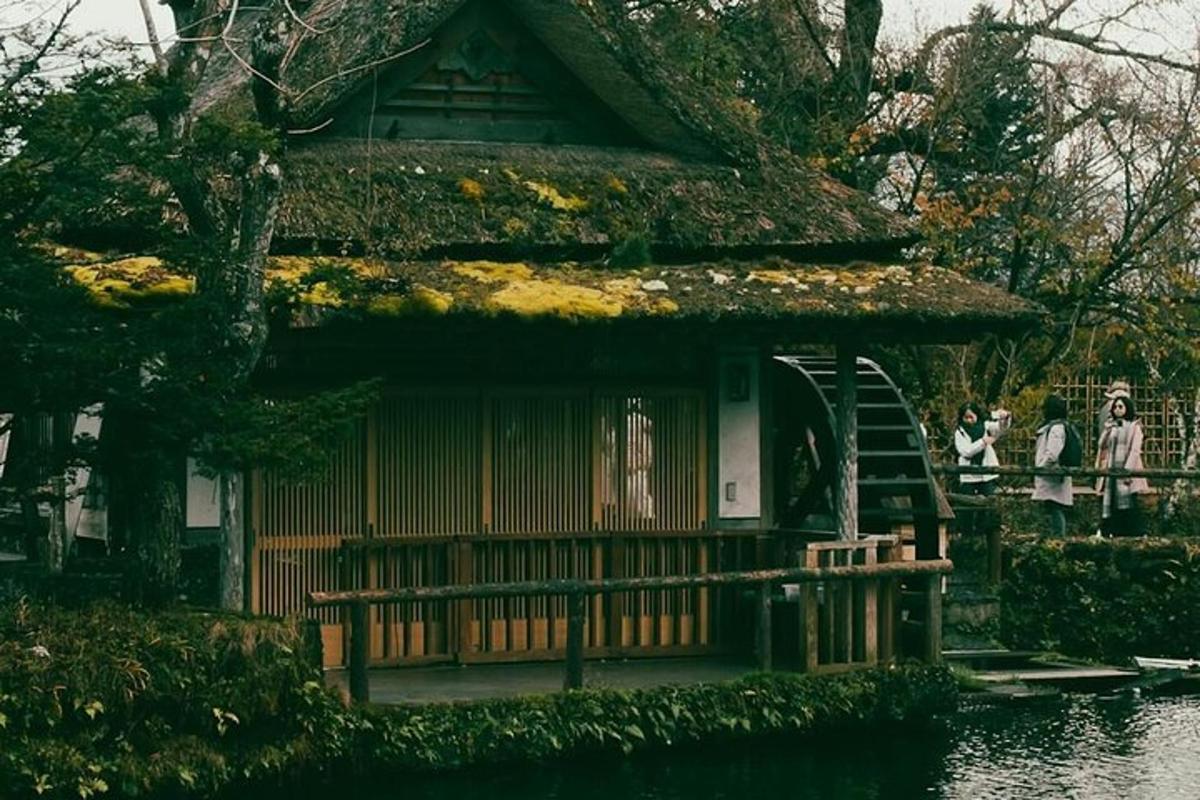 a small house with a porch and people walking around it