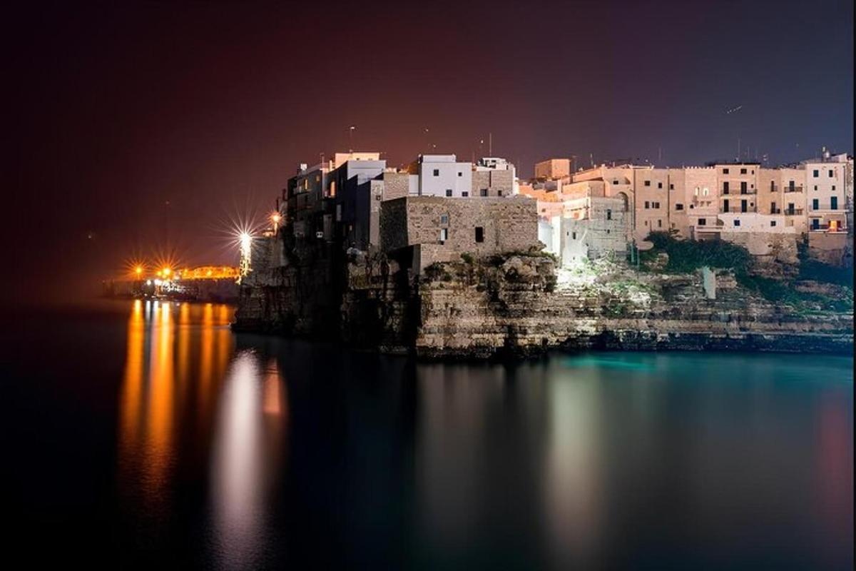 a view of a city at night from the water
