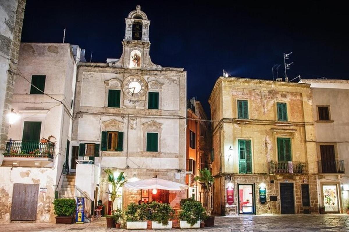 an old building with a clock tower at night