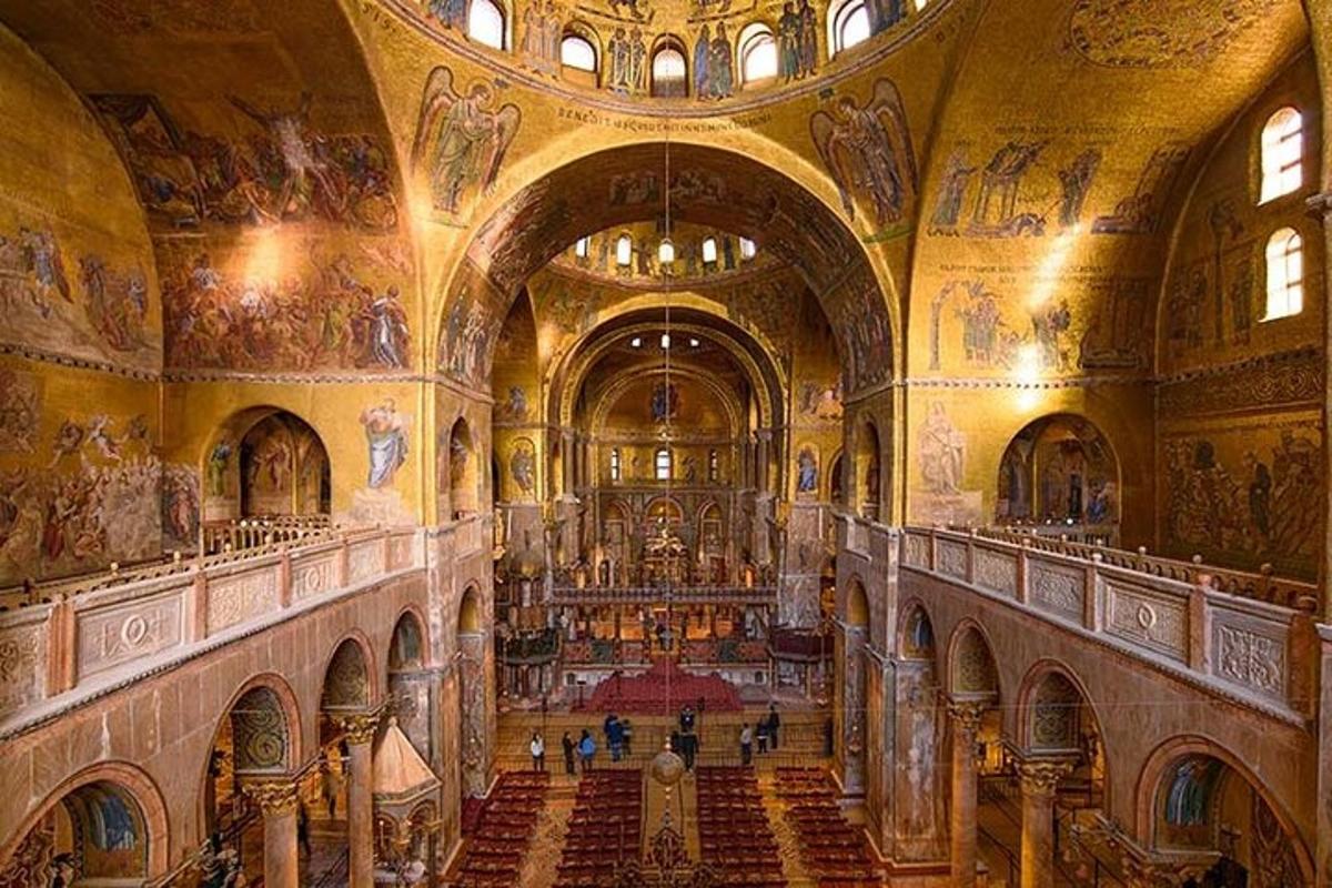 a large building with a church with paintings on the ceilings