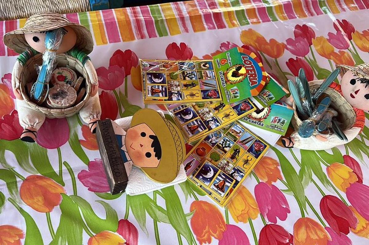 a table with a pile of toys on a table with flowers