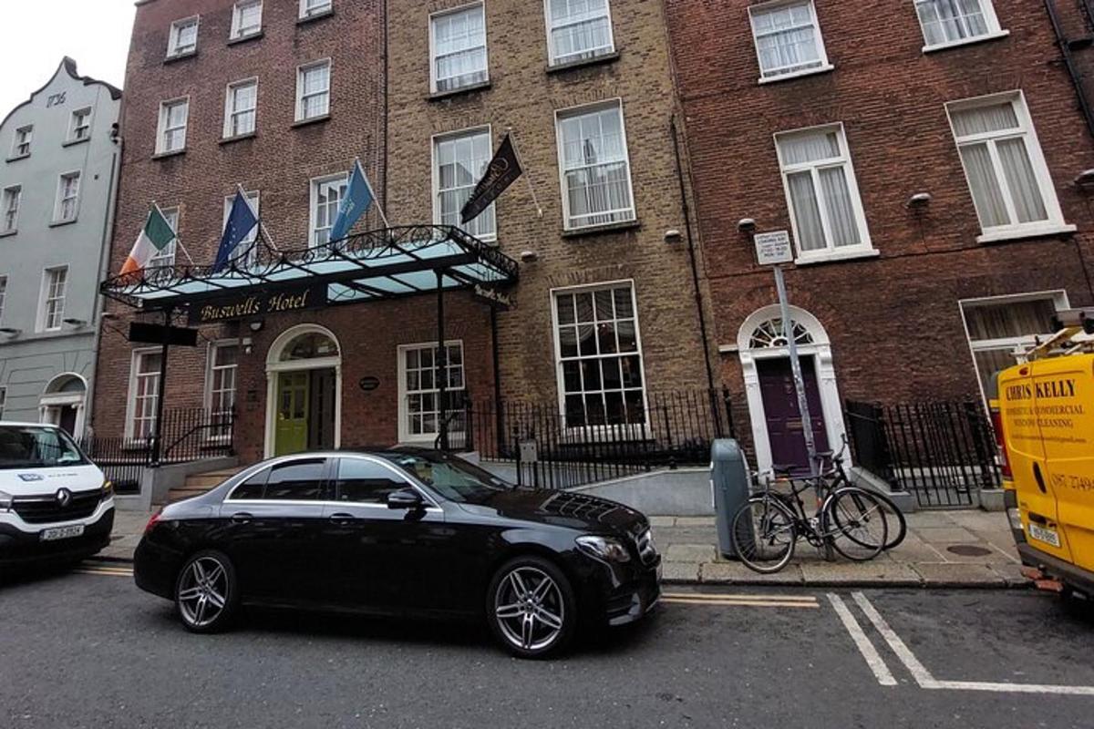 a black car parked in front of a building