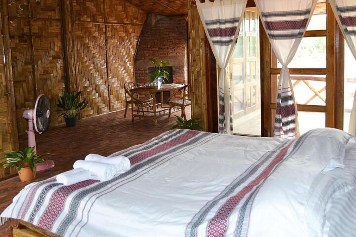 a bedroom with a bed in a room with a table