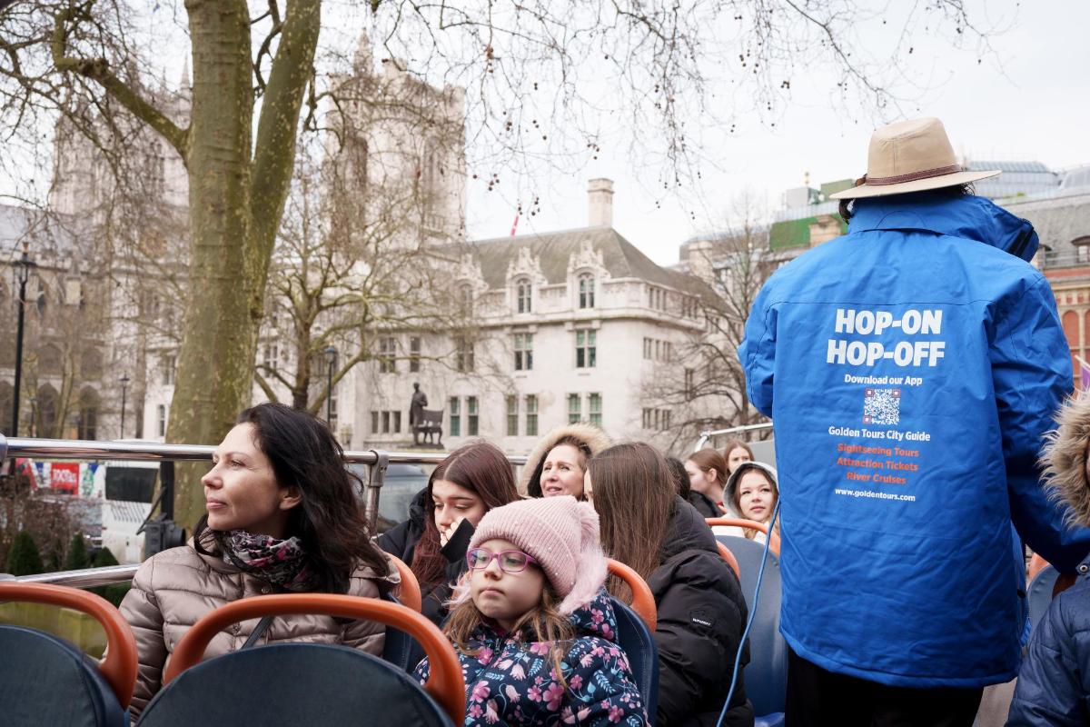 a group of people sitting in chairs in a crowd
