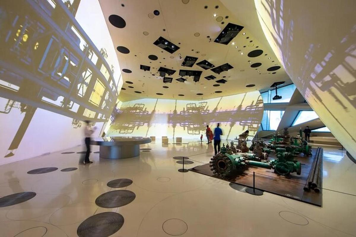 a museum with a tractor on display in a building