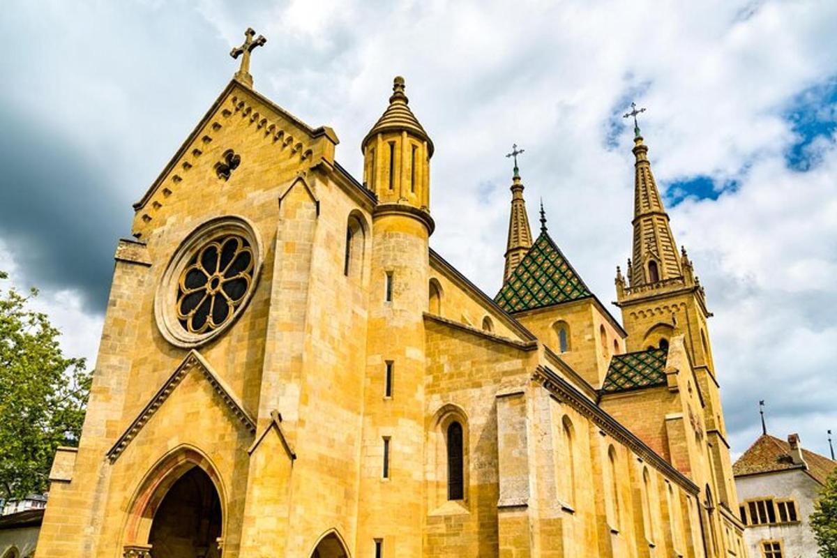 an old church with two spires and a clock tower