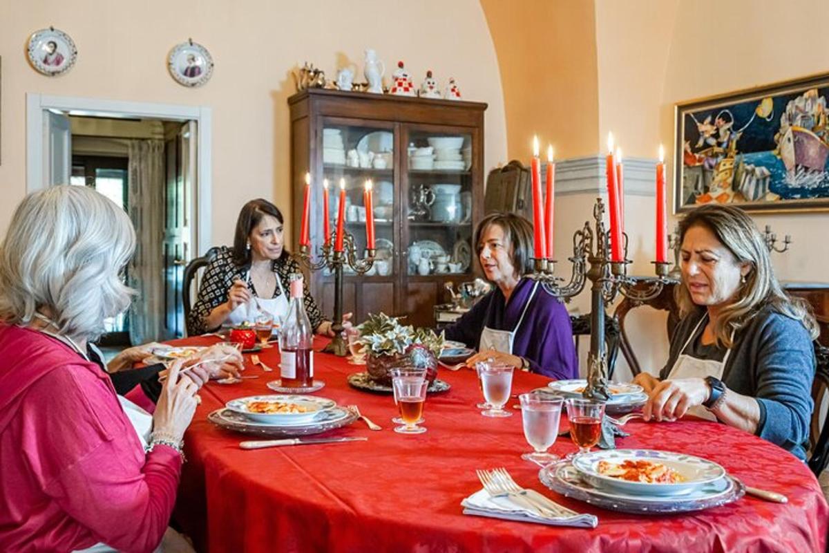 a group of people sitting around a table eating