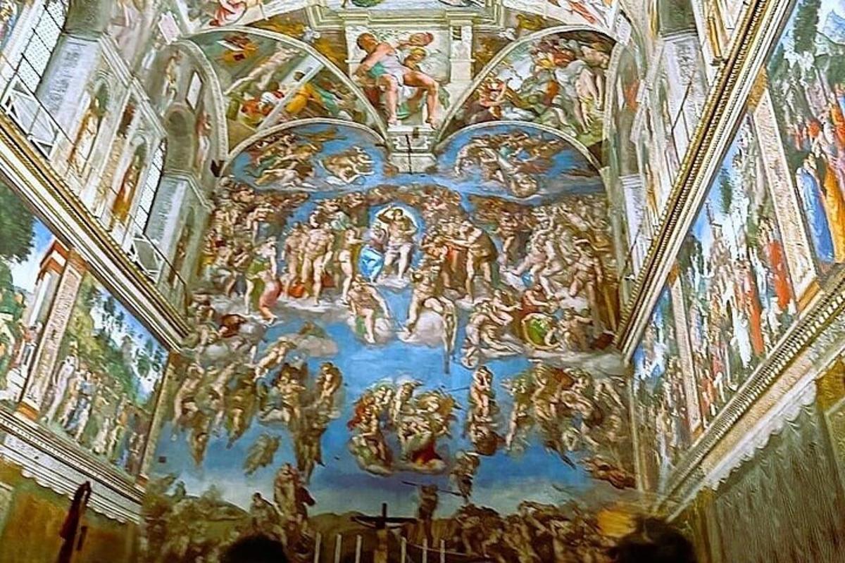 a large painting on the ceiling of a building