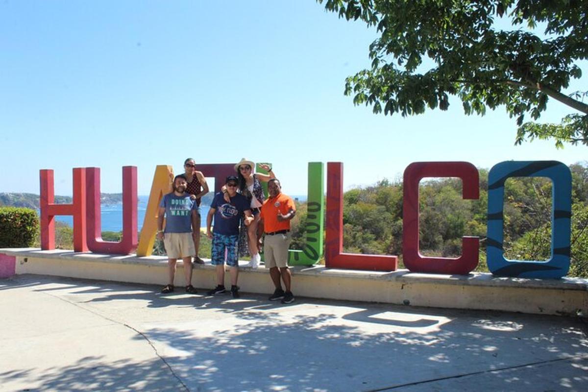 a group of people standing in front of a sign