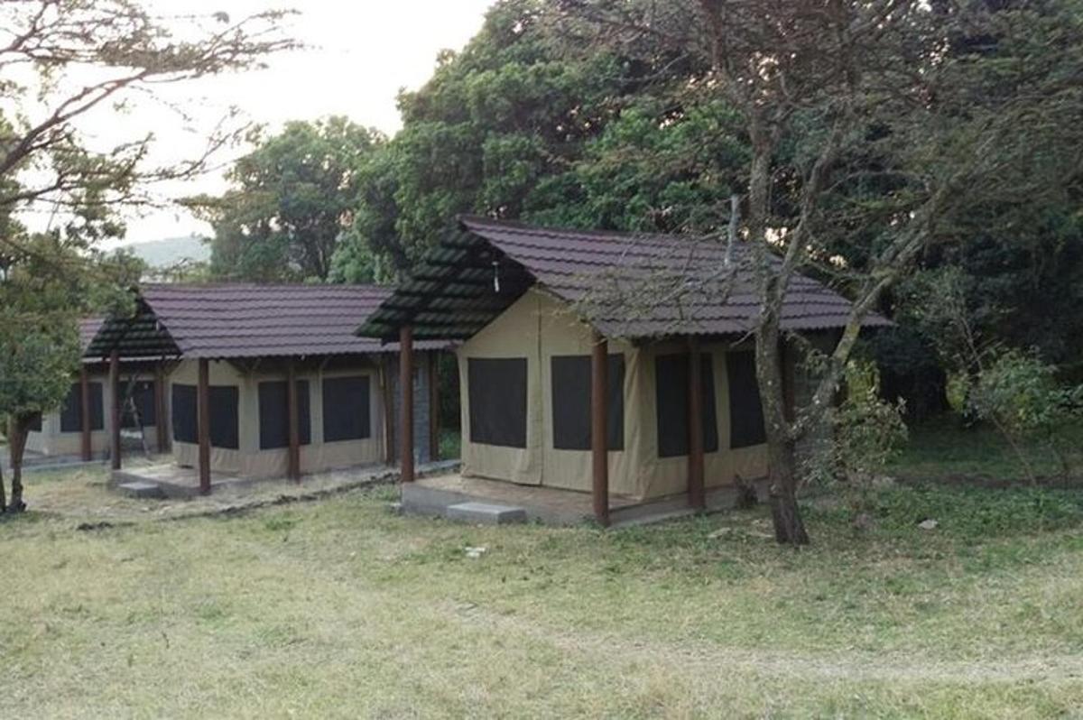 a small house in the middle of a field