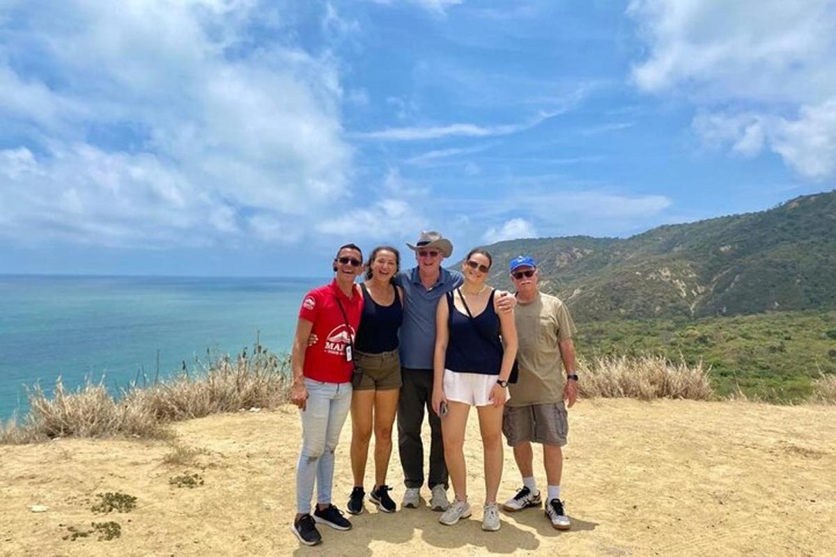 a group of people standing on top of a hill