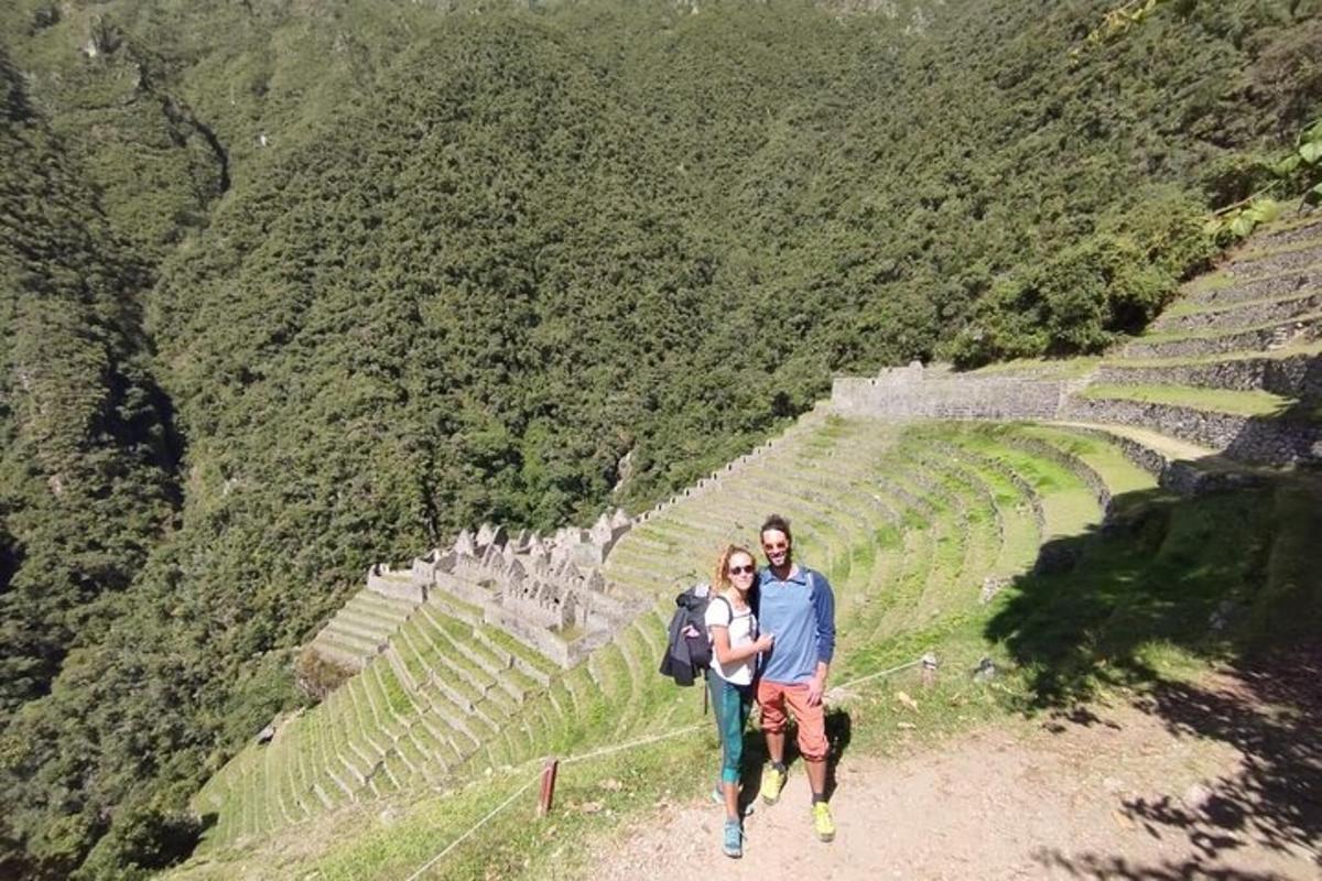 a man and a woman walking down a path at an amphitheater