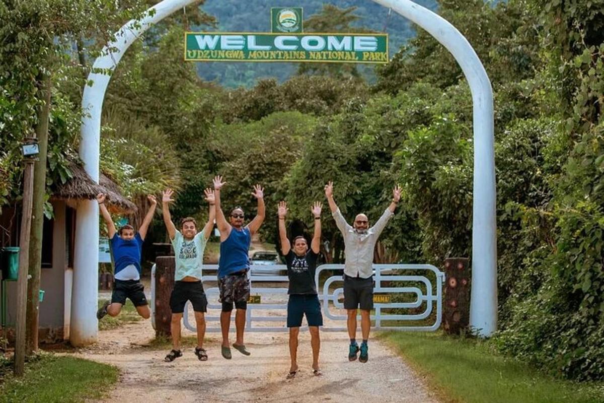 a group of men jumping in the air with their hands in the air