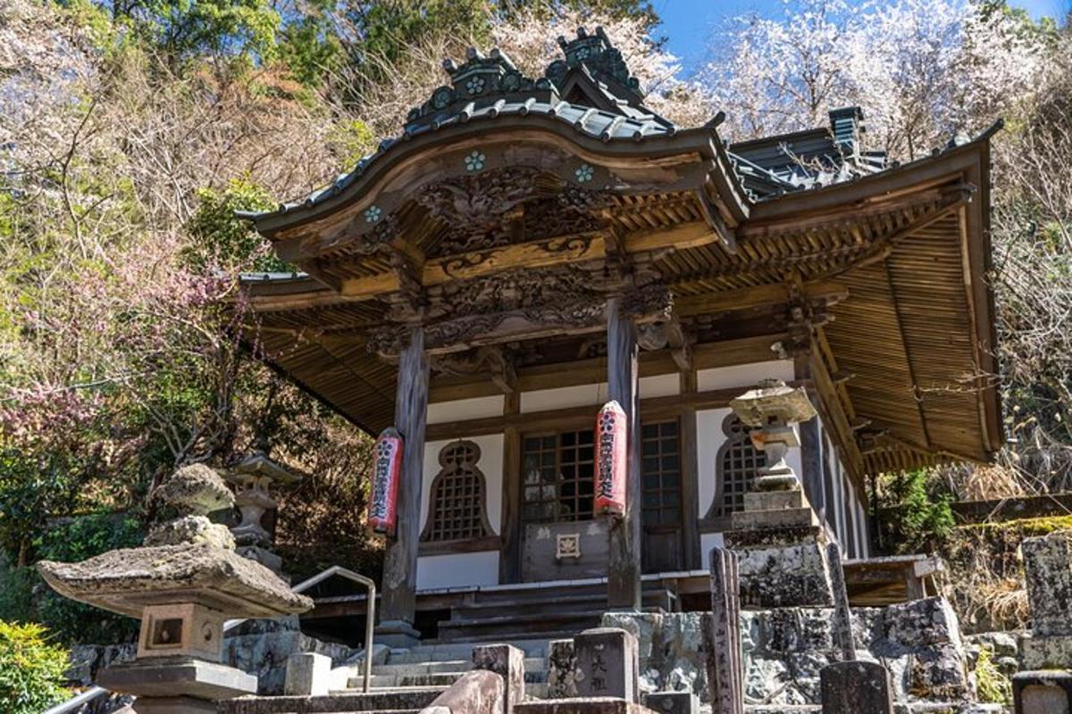 a small shrine in a mountain with trees