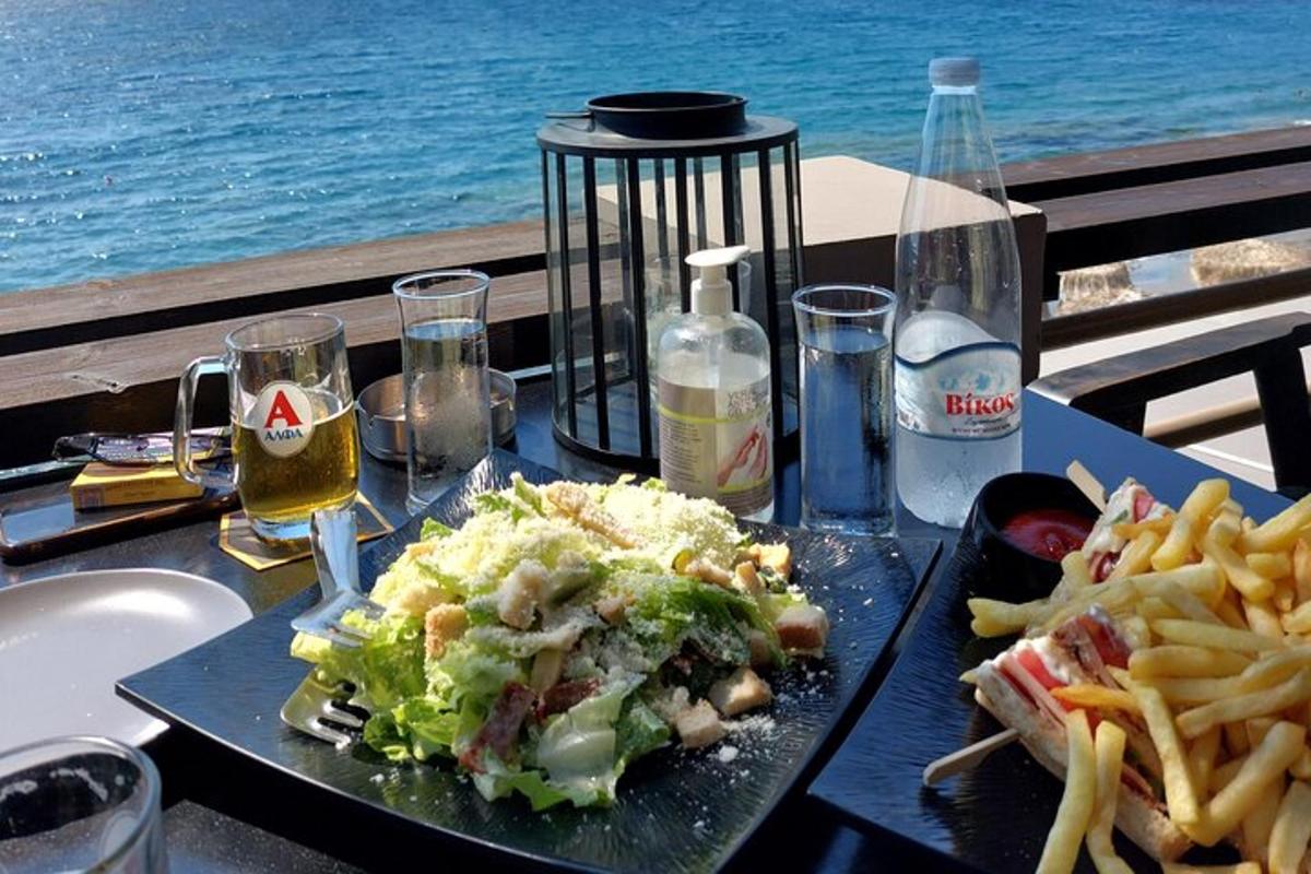 a table with a plate of food and french fries