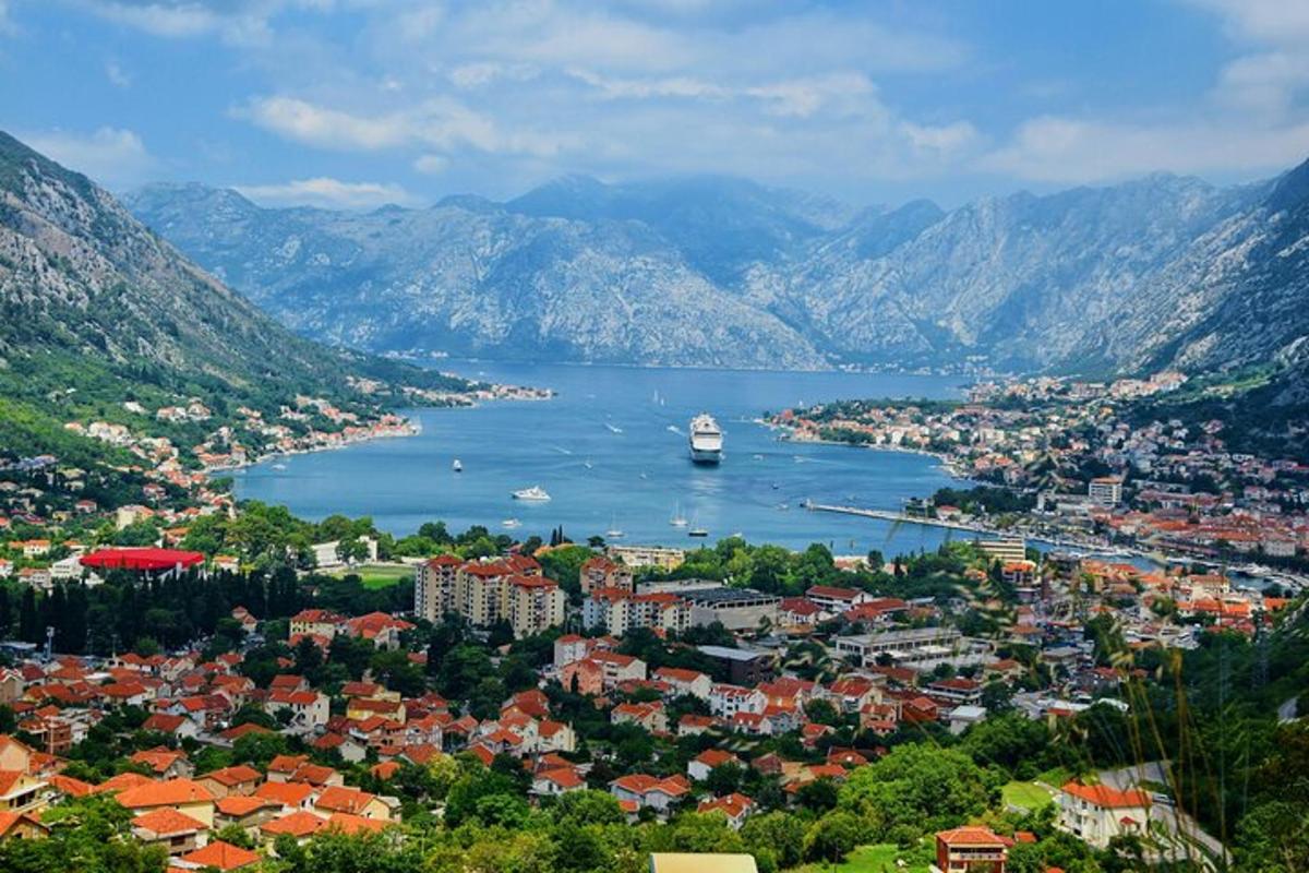 a city with a boat in a large body of water