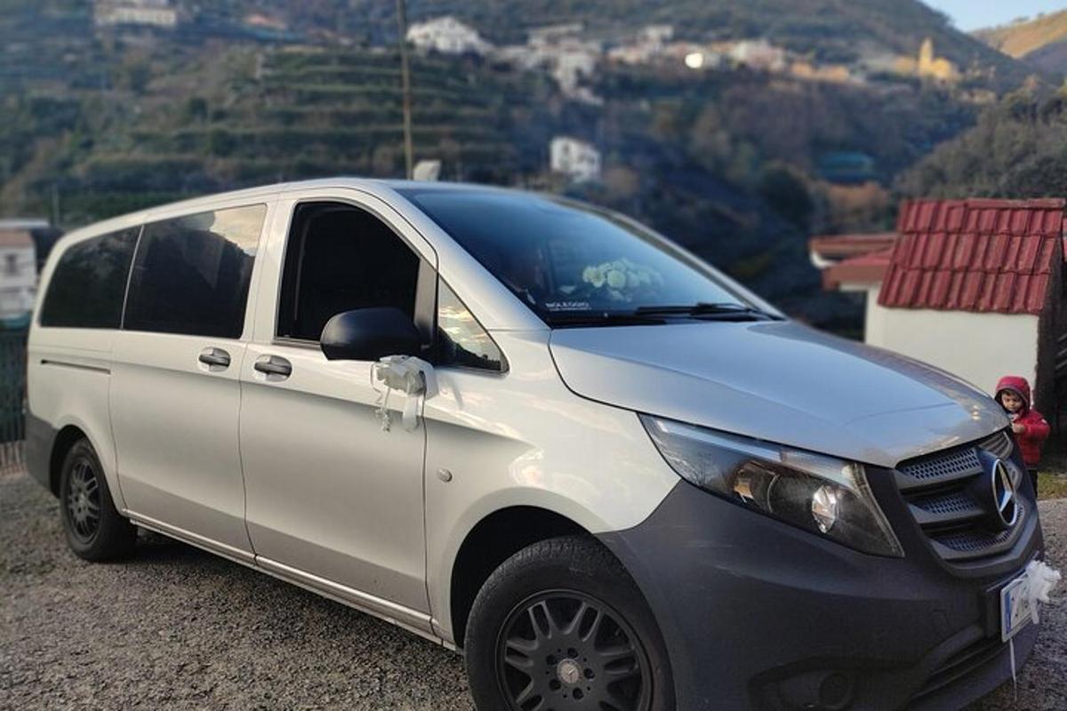 a white van parked on the side of a mountain