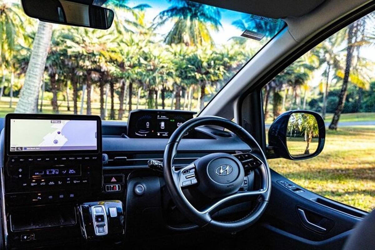a car with a laptop computer in the dashboard