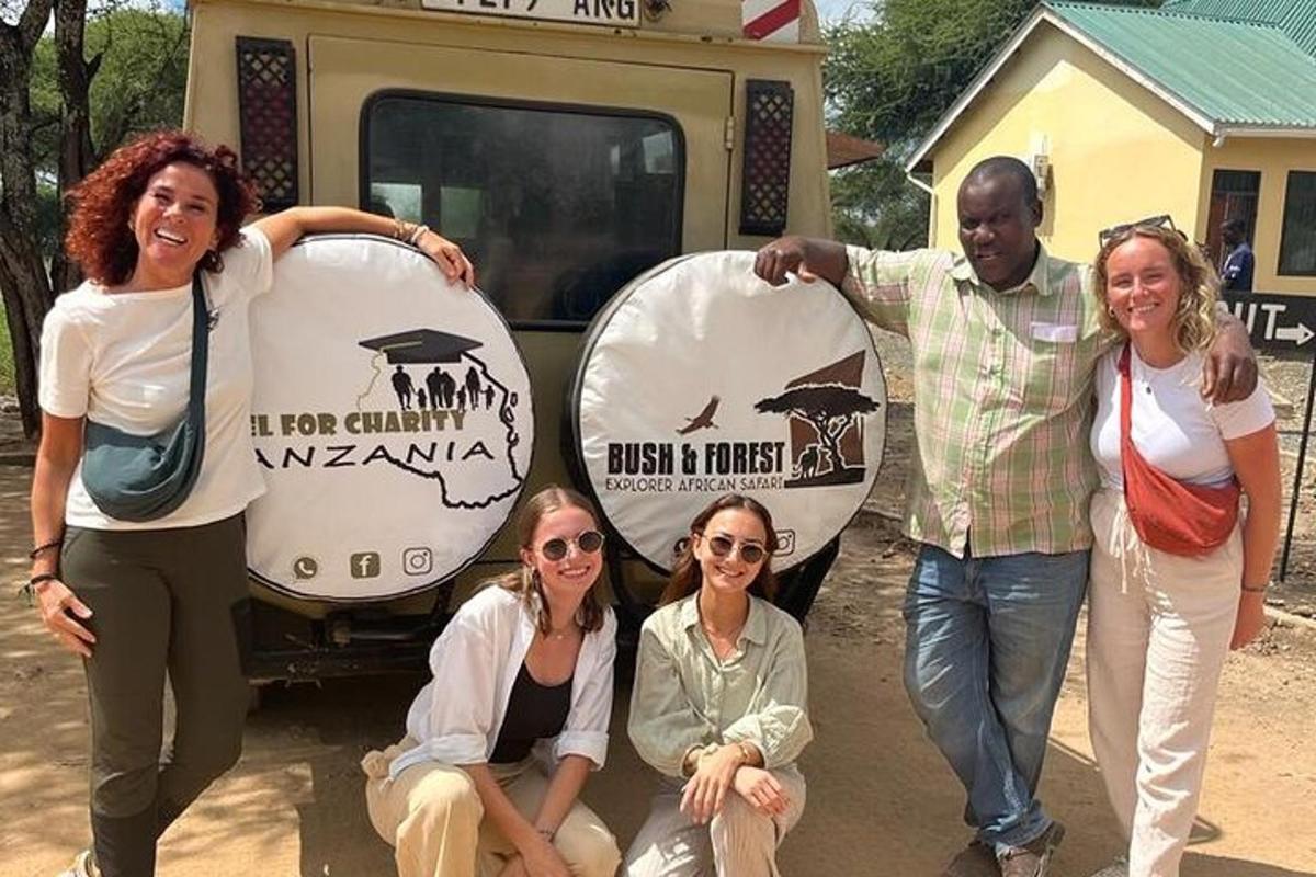 a group of people standing in front of a truck